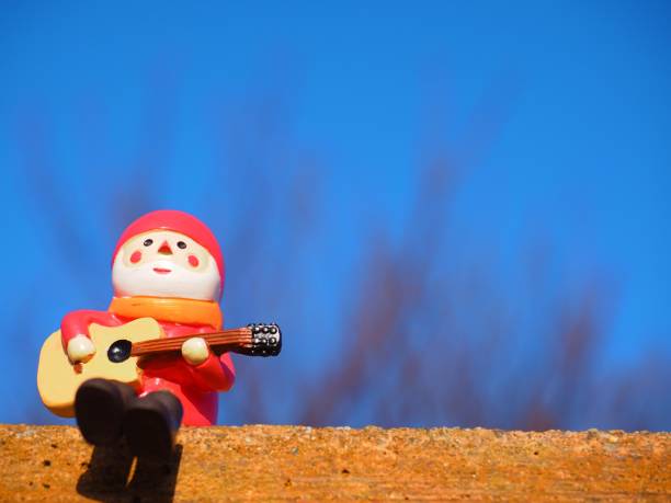 istock Santa Claus figurine playing the guitar 1081308780