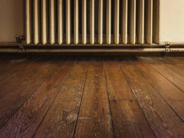 istock Wooden floor old radiator 1081309266