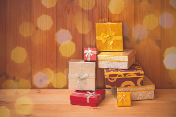 istock Presents on wooden background. 1081314450