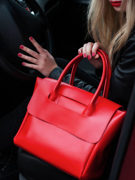 istock Girl with a red leather bag 1081314722
