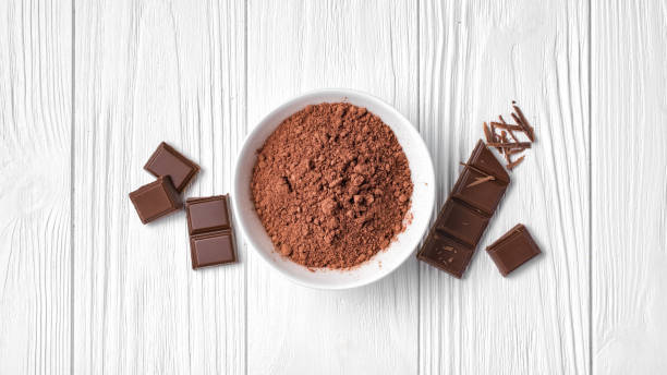 istock Top view of cocoa powder with broken chocolate bar 1081317378