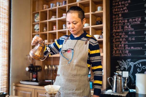 istock Male barista making pour-over coffee 1081317630