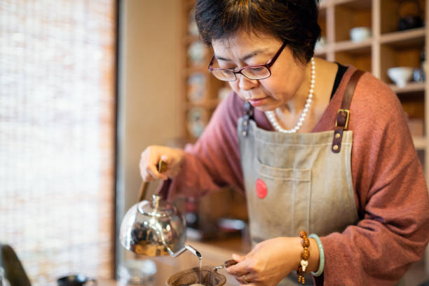 istock Female barista making pour-over coffee 1081325044