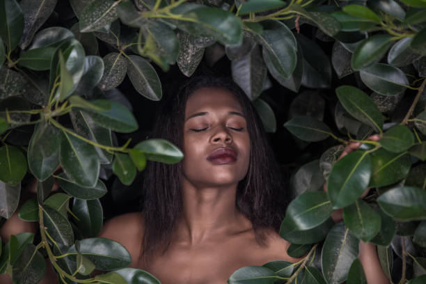 istock Black woman in frame of foliage 1081327664