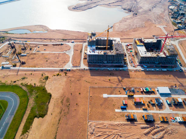 istock Aerial view of a Construction crane tower. Top view Crane and building working progress. Worker. Construction Site view by drone. Aerial top view a New buildings with a crane. Tower crane 1081330900