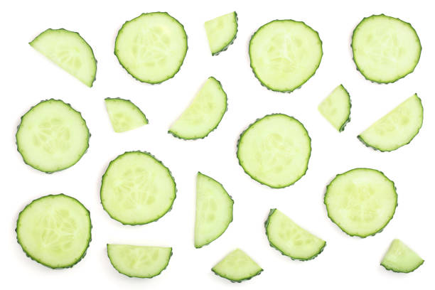 istock Cucumber slices isolated on white background. Top view. Flat lay pattern 1081335786