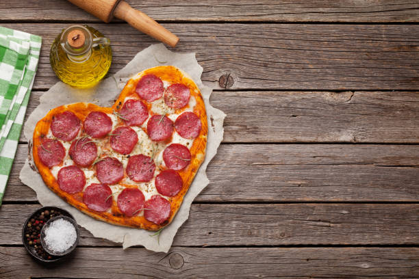 istock Heart shaped pizza with pepperoni 1081337134