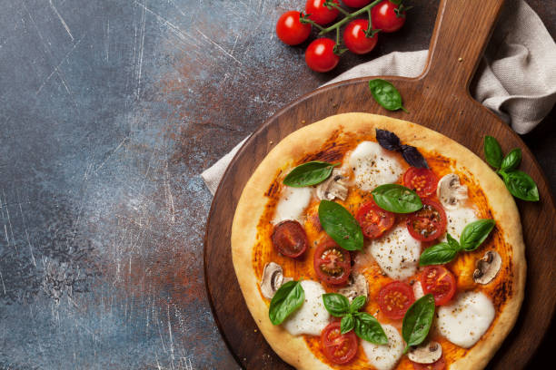istock Italian pizza with tomatoes, mozzarella and basil 1081337280