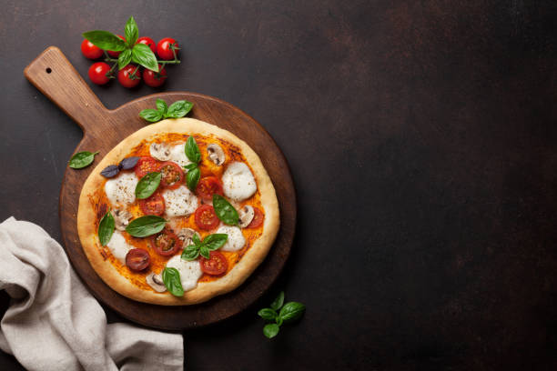 istock Italian pizza with tomatoes, mozzarella and basil 1081337316