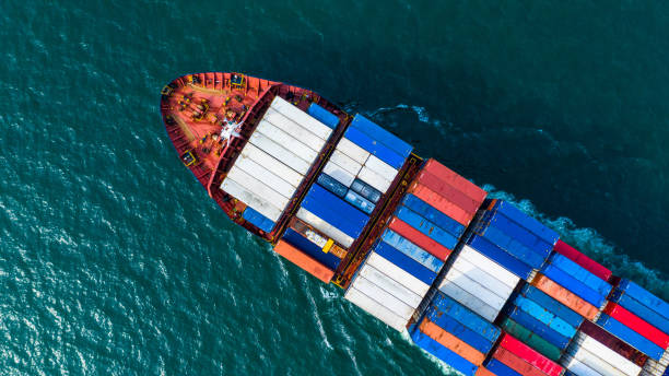 istock Aerial view cargo container ship carrying container for import and export, business logistic and freight transportation by ship in open sea. 1081338856
