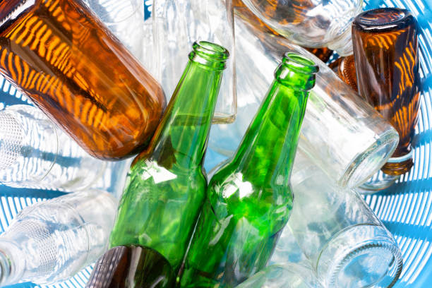 istock Glass bottles in waste basket. 1081339206