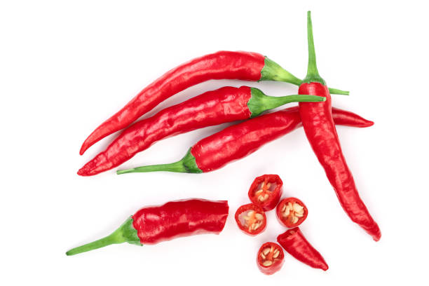 istock sliced red hot chili pepper isolated on white background. Top view. Flat lay pattern 1081343574