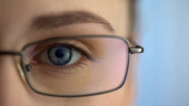 istock Female wearing eyeglasses and looking into camera, ophthalmic examination 1081345956