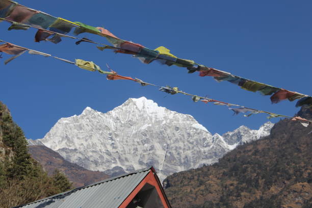 istock Prayer flags with the himalayas in the background 1081353402
