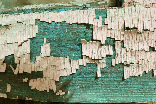 Old wooden texture with peeling paint, old blue board with cracked paint, vintage wood background, grunge plank. Old wooden background with remains of pieces of scraps of old paint on wood. Texture of an old tree, board with paint, vintage background peeling paint. old blue board with cracked paint, vintage, wood, background old blue board with cracked paint, vintage wood background, grunge plank. vieja textura de madera con la pintura descascarada, fondo madera antigua con restos de piezas de restos de pintura en madera. textura de un viejo árbol, tablero con pintura, fondo vintage pintura descascarada. antiguo tablero azul con la pintura agrietad