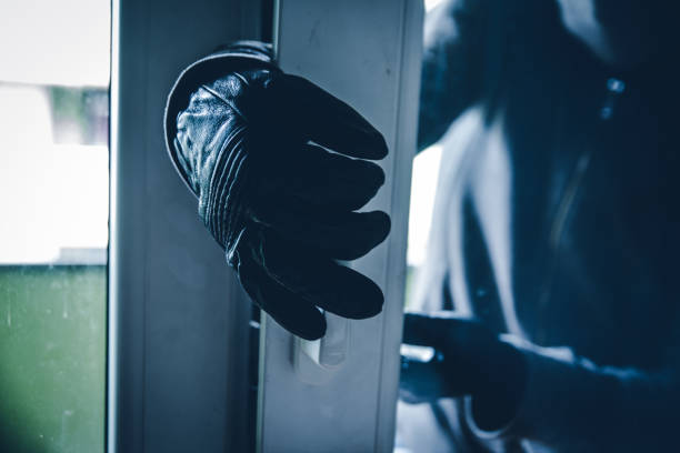 Burglar Breaking Into House Burglar Breaking Into House thief stock pictures, royalty-free photos & images