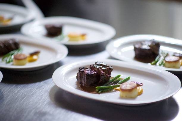 istock Steak on a plate being prepared in a Chef's kitchen 1081358328