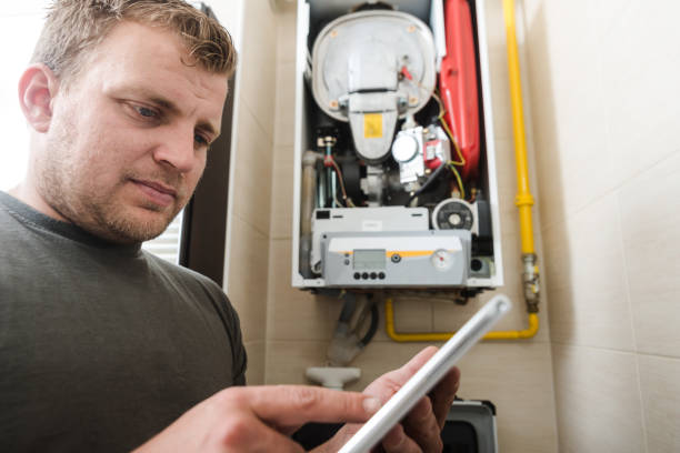 istock Technician repairing Gas Furnace using digital tablet 1081362102