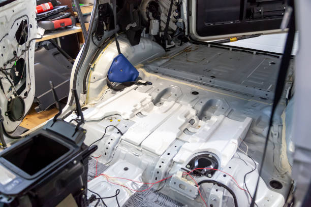 istock Disassembled car body, inside a white SUV, with parts and interior elements removed, prepared for the restoration and replacement of sound insulation and interior trim. 1081369190
