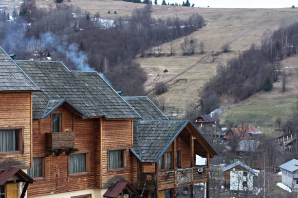 Wooden houses decorated with lanterns, day.
