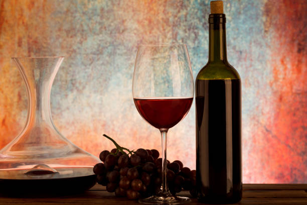 istock Decanter with red wine and glass on table 1081369970