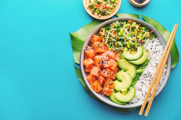 Poke bowl served on table stock photo