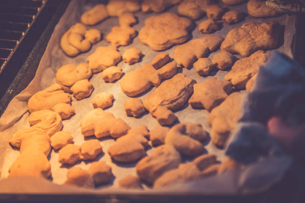 Baking Christmas cookies Oven Close Up. Europe.
