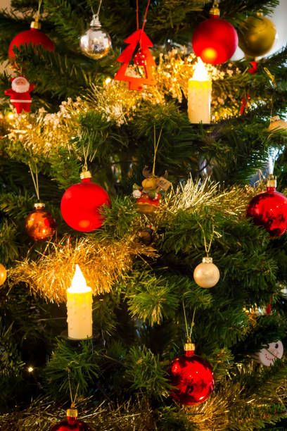istock Decorated christmas tree with flashing lights and illuminated electric candles 1081386316
