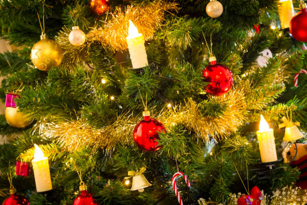 istock Decorated christmas tree with flashing lights and illuminated electric candles 1081386322