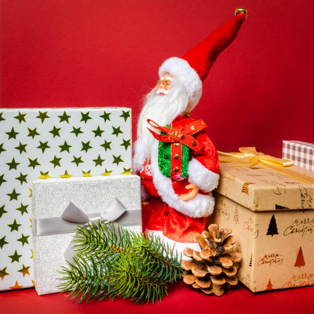 istock Santa Claus figure standing on a golden gift box 1081389436