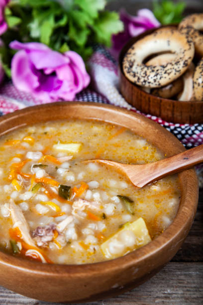 istock Pickle soup on old wooden table. 1081398794