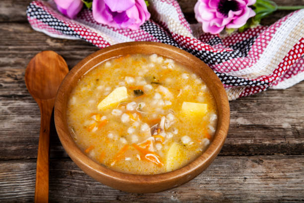 istock Pickle soup on old wooden table. 1081399374