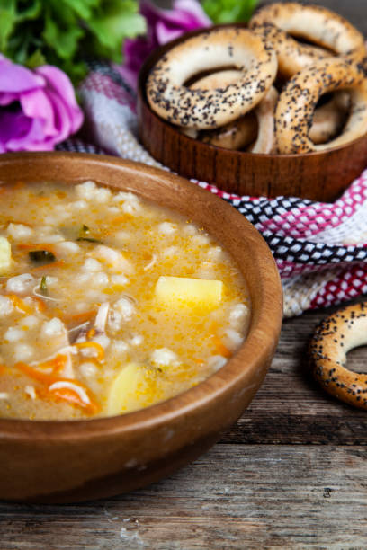 istock Pickle soup on old wooden table. 1081399560