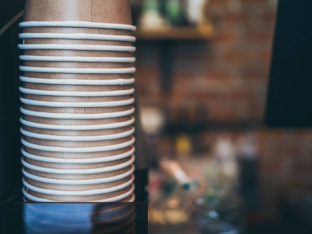 istock Stack of small brown paper cups in cafe 1081407710