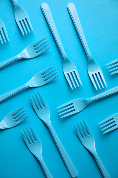 istock Close-up of forks on blue background 1081408258