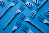 Close-up of forks on blue background