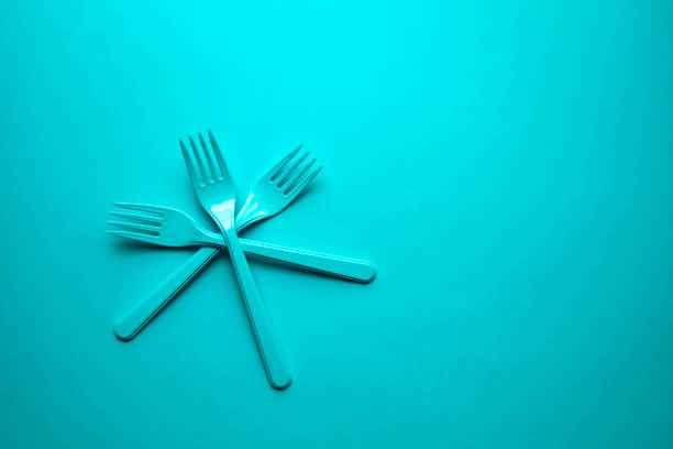 Close-up of forks on green background