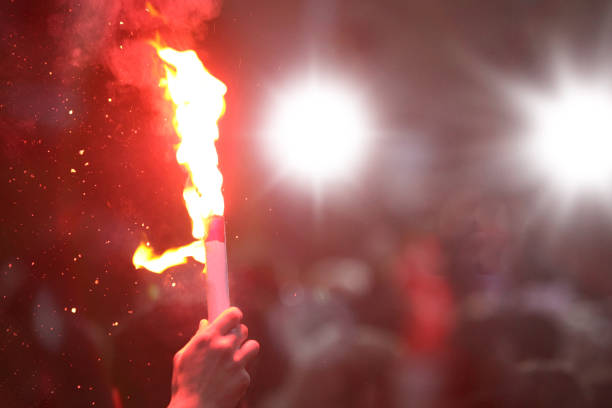 istock Hand holding burning hand flare 1081413822