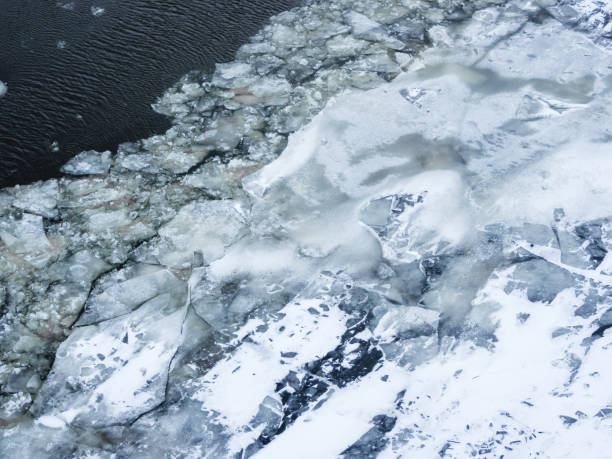 istock Broken ice on a frozen river. Water with shards of ice. 1081422596
