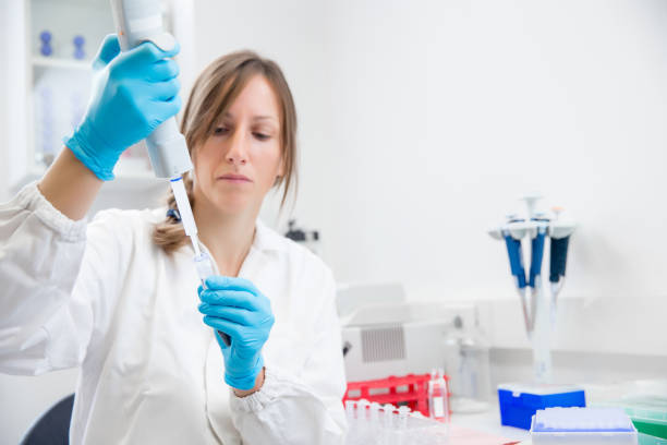 istock Female Researcher Preparing DNA Samples for PCR Analysis 1081426474