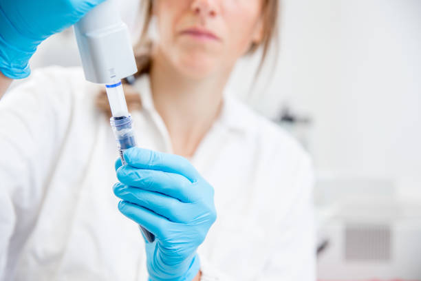 istock Female Researcher Preparing DNA Samples for PCR Analysis 1081426482