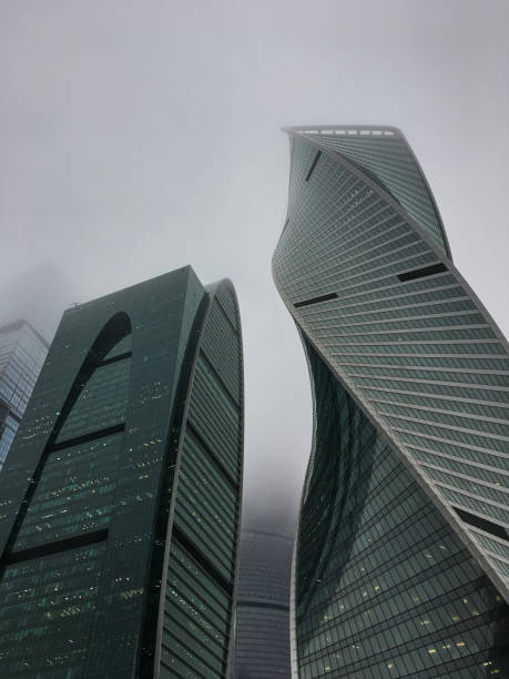 istock Modern building from a low angle, overcast day. fog 1081428822
