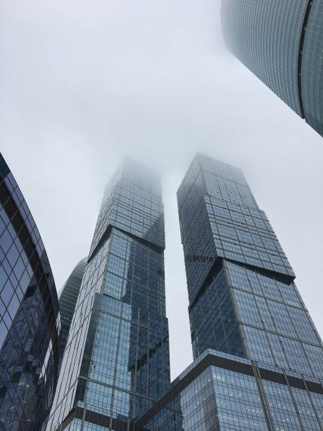 istock Modern building from a low angle, overcast day. fog 1081428832