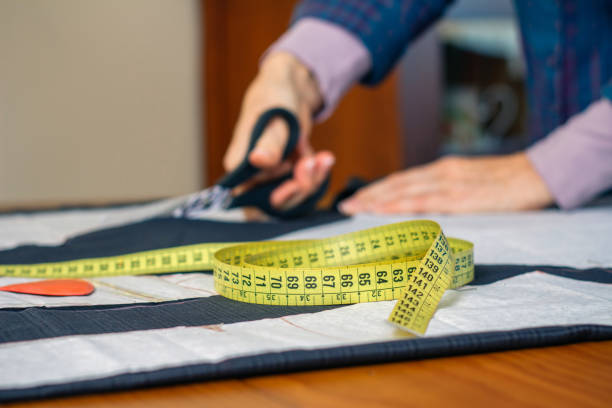 istock Measuring tape with dressmaker cutting in background 1081450154