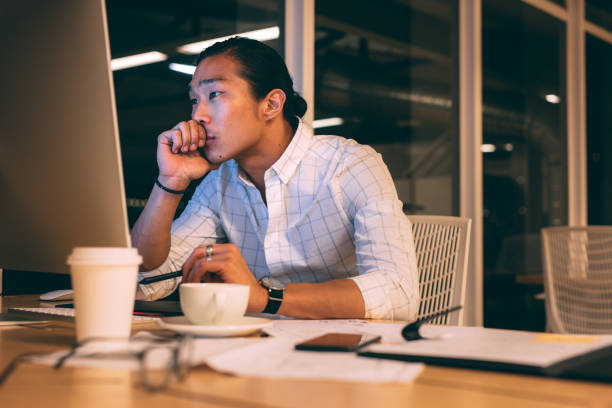 istock Businessman working in office looking tensed 1081451002