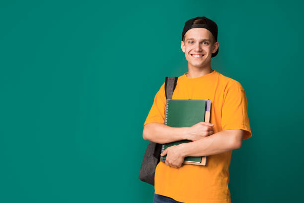 istock Happy student with books and backpack over background 1081457216