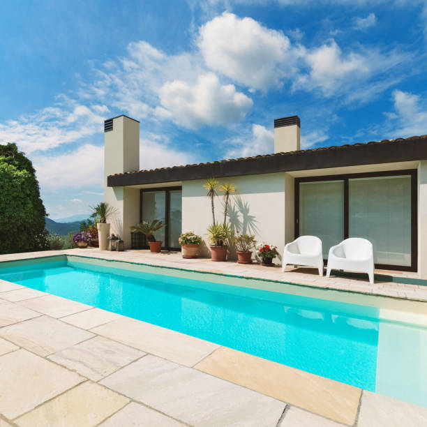 istock Beautiful white house with pool, outdoors 1081458368