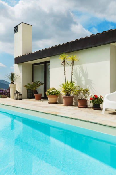 istock Beautiful white house with pool, outdoors 1081459396