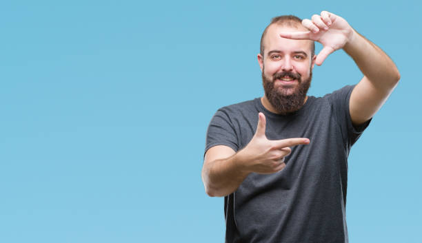 istock Young caucasian hipster man over isolated background smiling making frame with hands and fingers with happy face. Creativity and photography concept. 1081472964