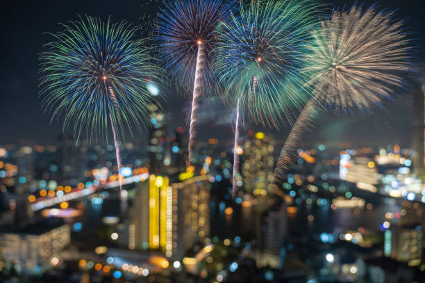 istock Fantastic Multicolor Firework Celebration over the Abstract Photo blurred bokeh of bangkok cityscape river view at twilight time, happy new year and celebration concept 1081478708